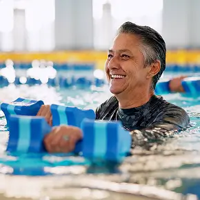 Swimming with a smiling face related Aquatic Therapy